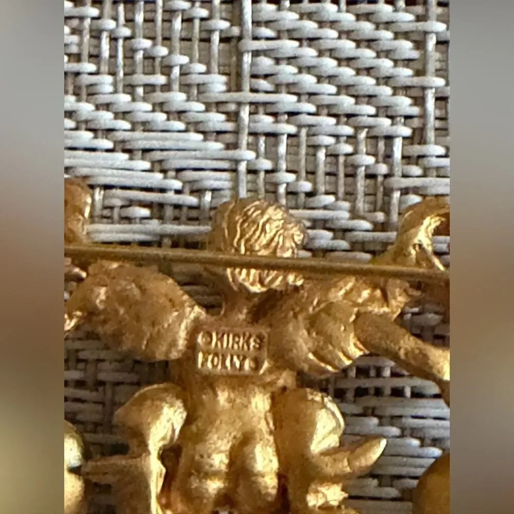 Kirks Folly cherub brooch